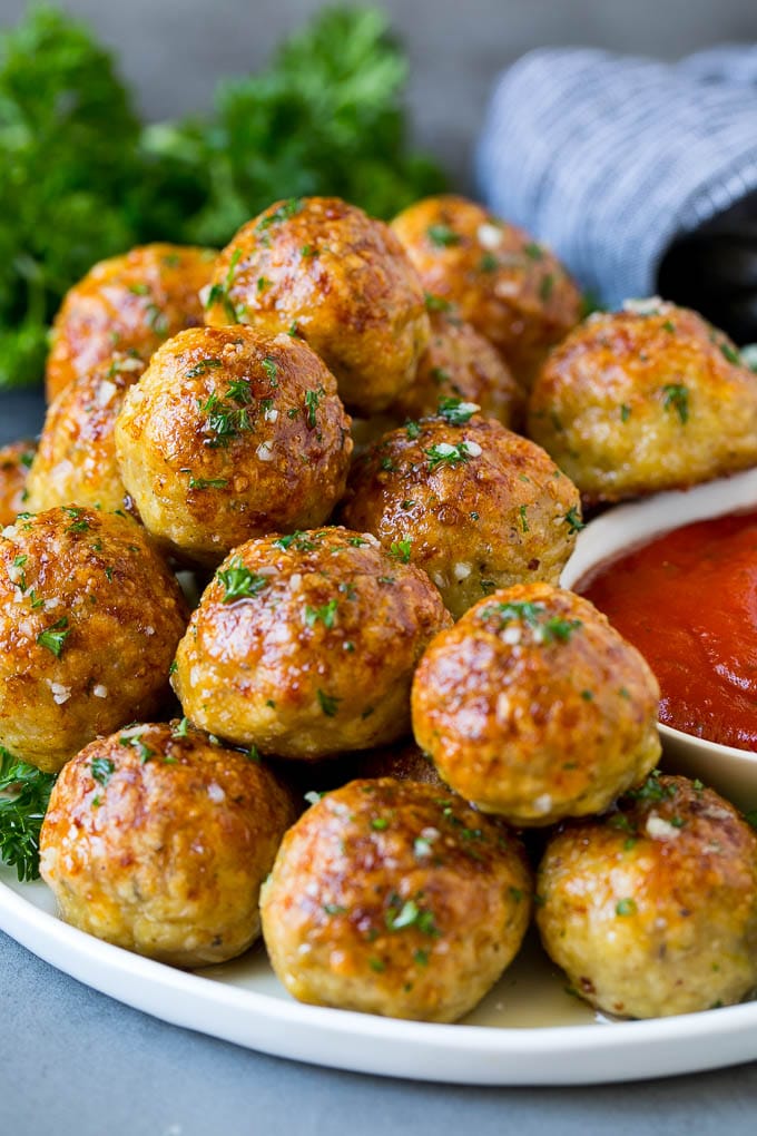Chicken Meatballs Recipe | Baked Meatballs #chicken #meatballs #dinner #bajap #comfortfood A serving plate of chicken meatballs served with marinara sauce.