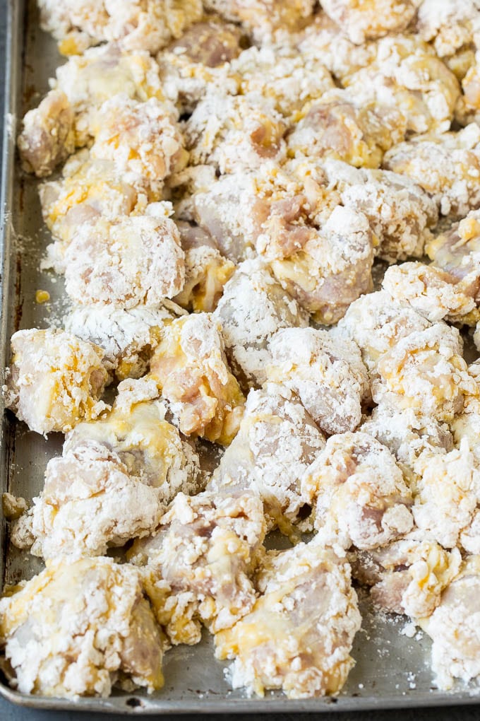 General Tso's Chicken Recipe #chicken #asianfood #dinner #bajap #copycatrecipe Chicken pieces coated in egg, flour and cornstarch.