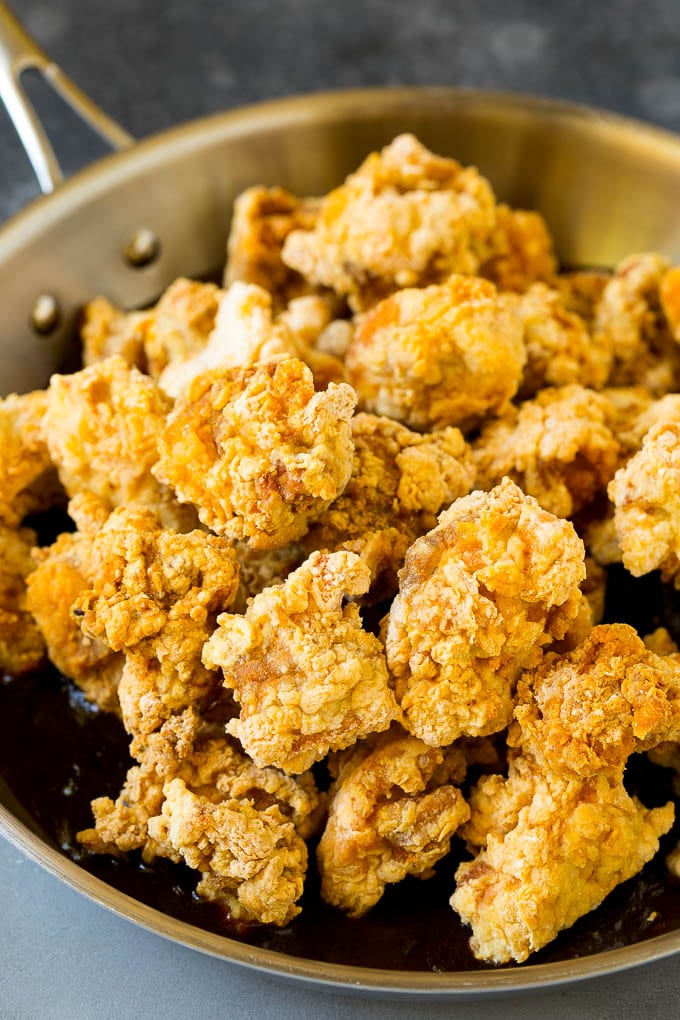 General Tso's Chicken Recipe #chicken #asianfood #dinner #bajap #copycatrecipe Crispy chicken in a skillet filled with savory and spicy sauce.