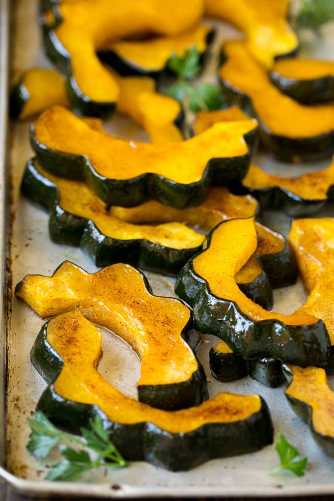 Roasted Acorn Squash | Acorn Squash Recipe #squash #winter #sidedish #dinner #bajap Roasted acorn squash garnished with fresh parsley.