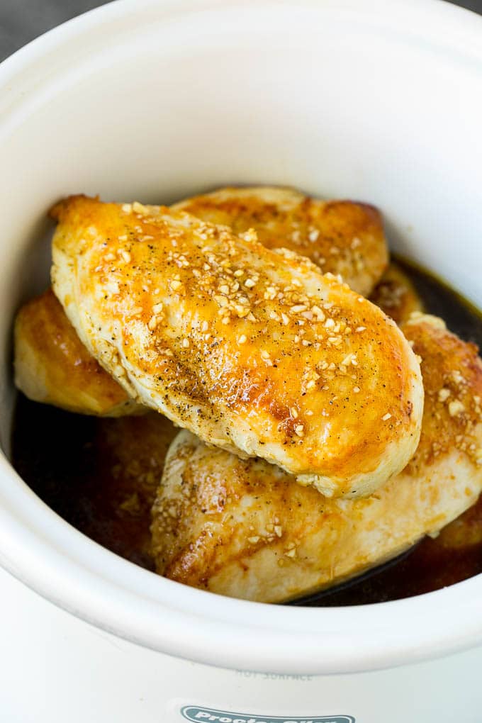 Slow Cooker Chicken Breast Recipe | Crock Pot Chicken Breast | Chicken and Gravy #chicken #slowcooker #crockpot #gravy #dinner #bajap Chicken breasts with garlic and herb sauce poured over the top.