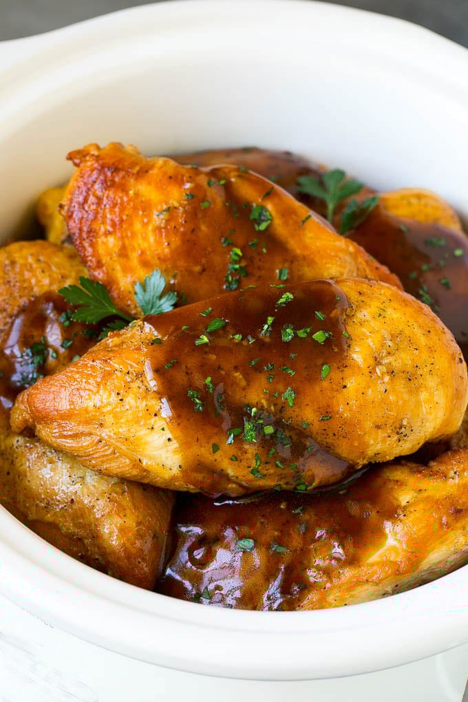 Slow Cooker Chicken Breast Recipe | Crock Pot Chicken Breast | Chicken and Gravy #chicken #slowcooker #crockpot #gravy #dinner #bajap Slow cooker chicken breast topped with gravy and parsley.