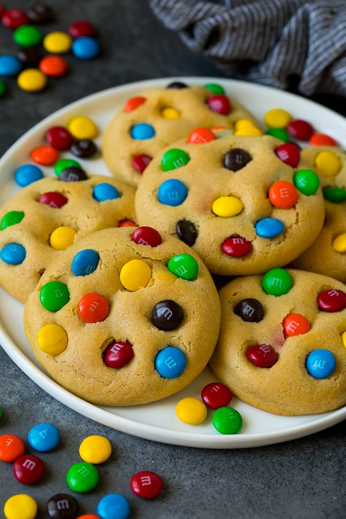 M&M Cookies Recipe #cookies #chocolate #baking #dessert #sweets #bajap A plate of M&M cookies, garnished with extra candy.