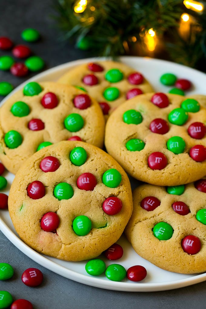 M&M Cookies Recipe #cookies #chocolate #baking #dessert #sweets #bajap A plate of Christmas cookies with red and green M&Ms in them.