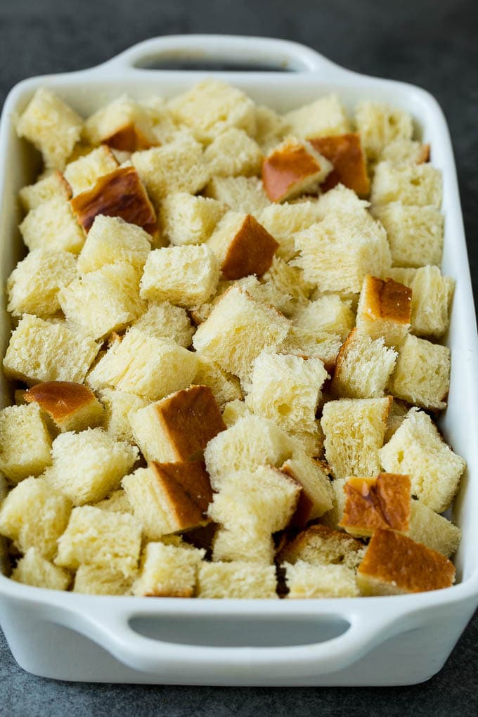 French Toast Casserole Recipe | French Toast Bake #frenchtoast #casserole #breakfast #brunch #bajap #bread Cubes of bread in a baking dish.
