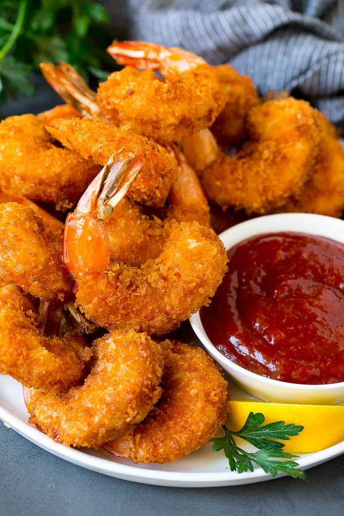 Fried Shrimp Recipe #shrimp #seafood #dinner #appetizer #bajap A plate of fried shrimp served with cocktail sauce.