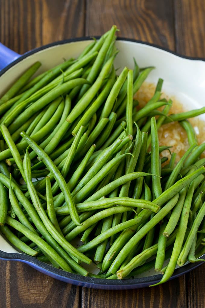 Green Beans with Bacon Recipe | Bacon Green Beans #bacon #greenbeans #sidedish #thanksgiving #veggies #dinner #bajap Beans in a pan with onions.