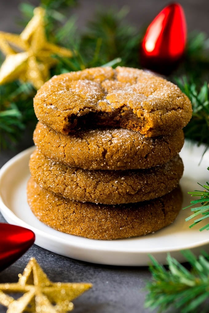 Molasses Cookies Recipe | Spice Cookies #cookies #baking #christmas #dessert #bajap A stack of molasses cookies with a bite taken out of one.