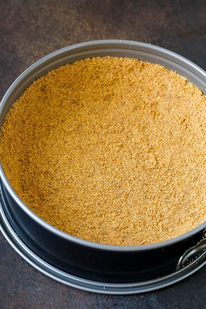 Pumpkin Pie Cheesecake Recipe | Pumpkin Cheesecake #cake #cheesecake #pumpkin #fall #thanksgiving #dessert #bajap Graham cracker crust in a springform pan.