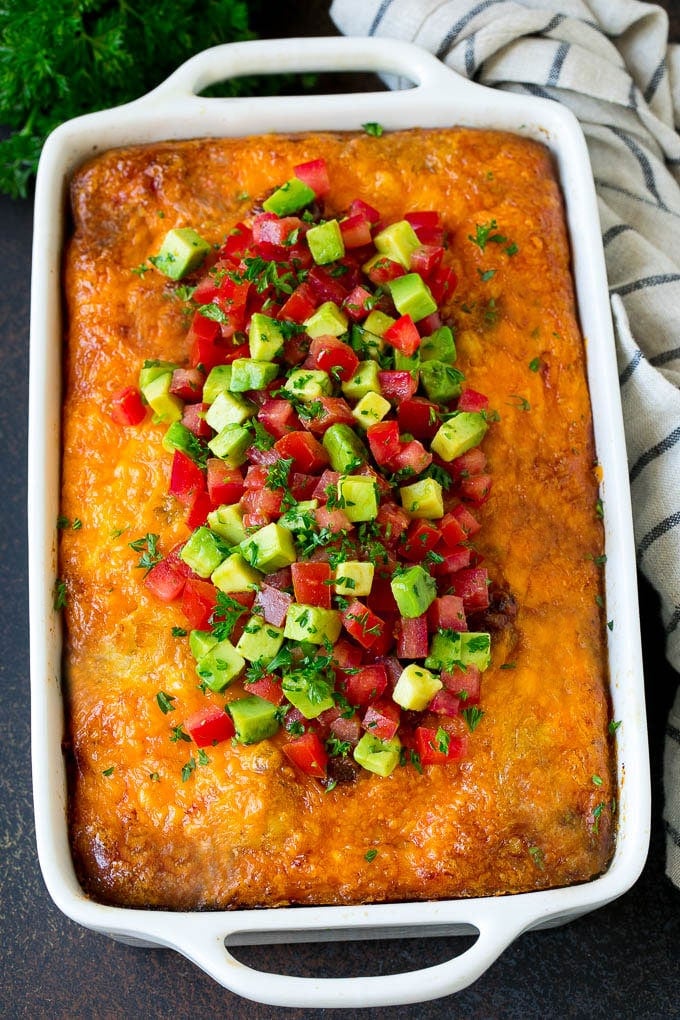 Sausage Egg Casserole Recipe | Egg Casserole #eggs #sausage #potato #cheese #casserole #breakfast #brunch #bajap Sausage egg casserole topped with avocado and tomato.