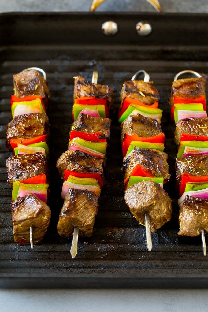 Beef Shish Kabobs Recipe | Beef Kabobs #grilling #beef #steak #dinner #bajap #peppers Beef skewers cooking on a grill pan.