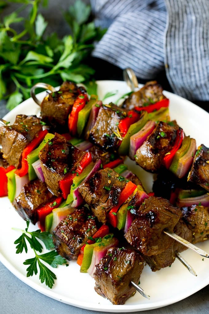 Beef Shish Kabobs Recipe | Beef Kabobs #grilling #beef #steak #dinner #bajap #peppers Shish kabob made with beef, peppers and onions on a serving plate.