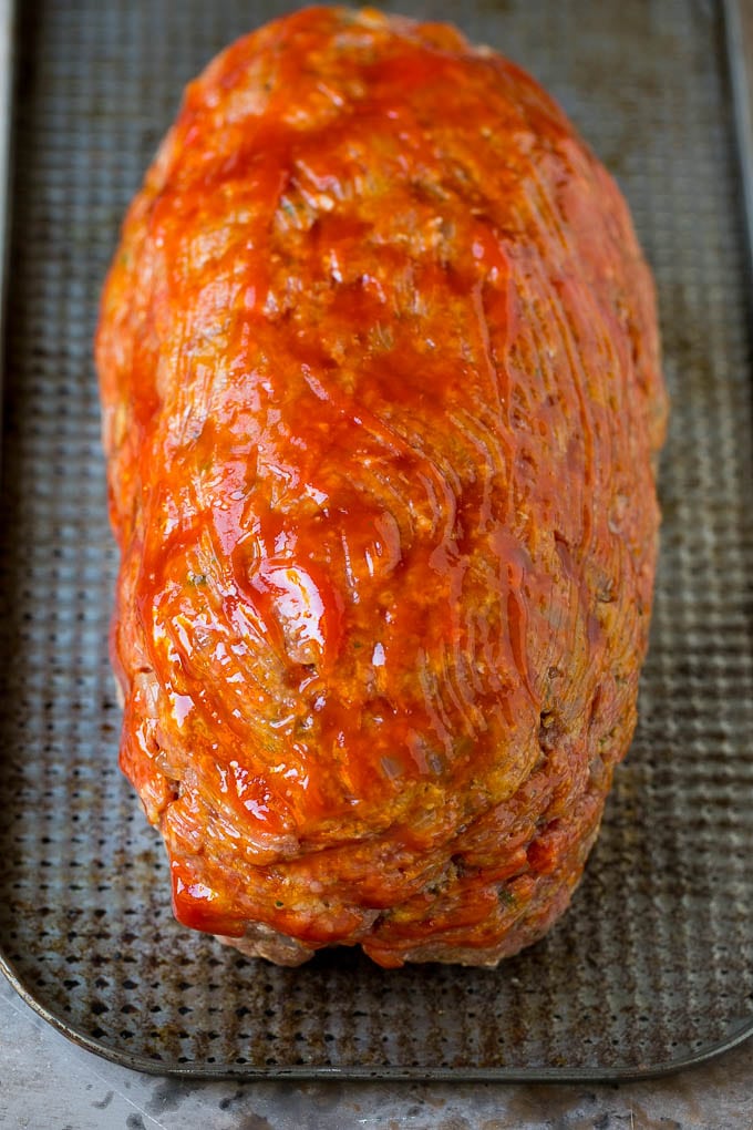 Bacon Wrapped Meatloaf Recipe | Beef Meatloaf #meatloaf #beef #groundbeef #bacon #dinner #bajap Ground beef shaped into a loaf and coated in ketchup.