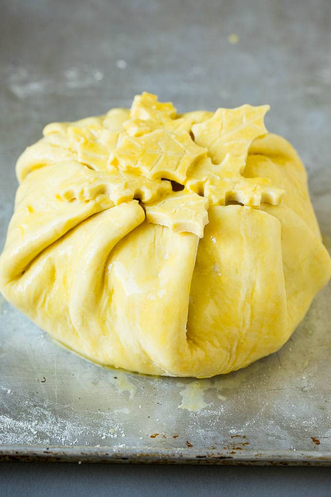 Baked Brie Recipe | Pastry Wrapped Brie #brie #cheese #appetizer #pecans #raspberries #bajap Cheese wrapped in puff pastry and topped with egg wash.