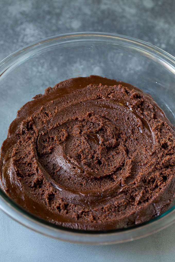 Chocolate Crinkle Cookies Recipe #cookies #chocolate #christmas #dessert #baking #bajap A bowl of chocolate cookie dough.