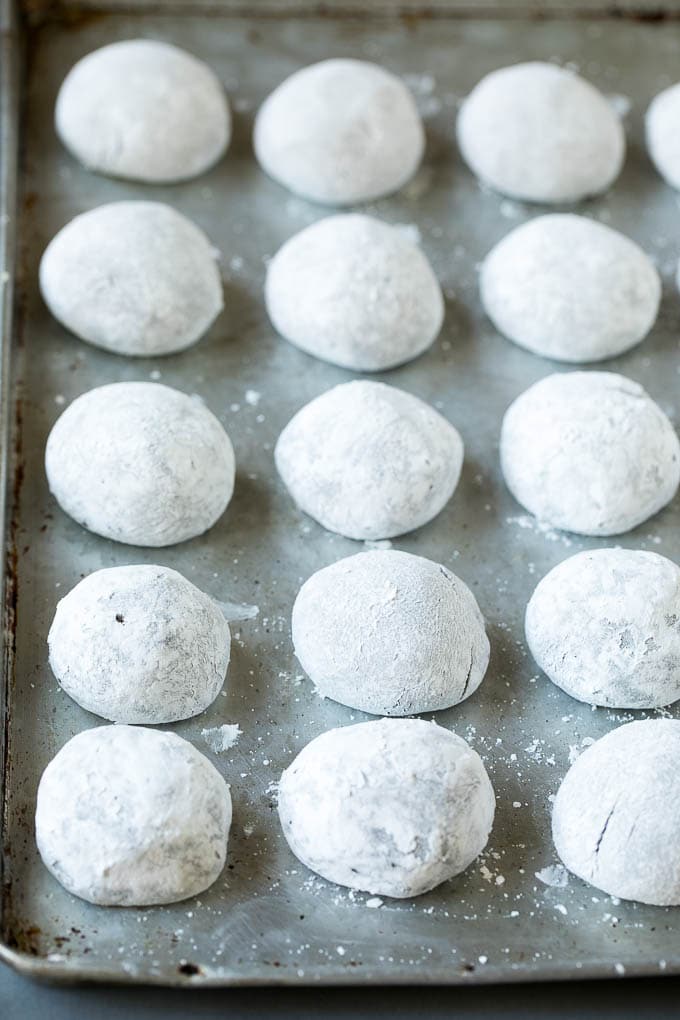Chocolate Crinkle Cookies Recipe #cookies #chocolate #christmas #dessert #baking #bajap Balls of cookie dough rolled in powdered sugar.