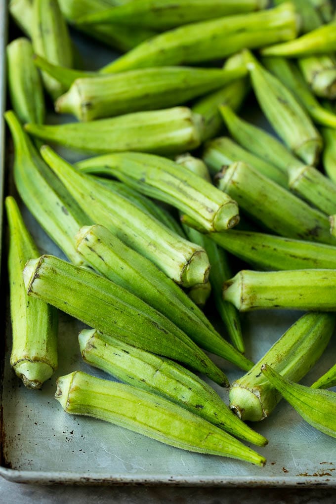 Fried Okra Recipe #okra #appetizer #sidedish #bajap Okra pods on a sheet pan.