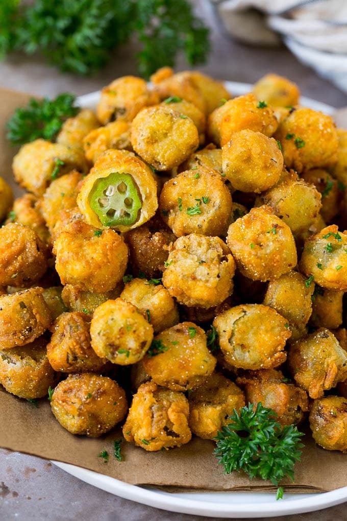 Fried Okra Recipe #okra #appetizer #sidedish #bajap A serving plate of fried okra garnished with parsley.