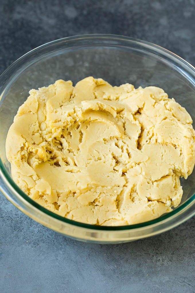 Italian Cookies Recipe | Almond Cookies #cookies #italianfood #frosting #sprinkles #baking #christmas #bajap Almond cookie dough in a mixing bowl.
