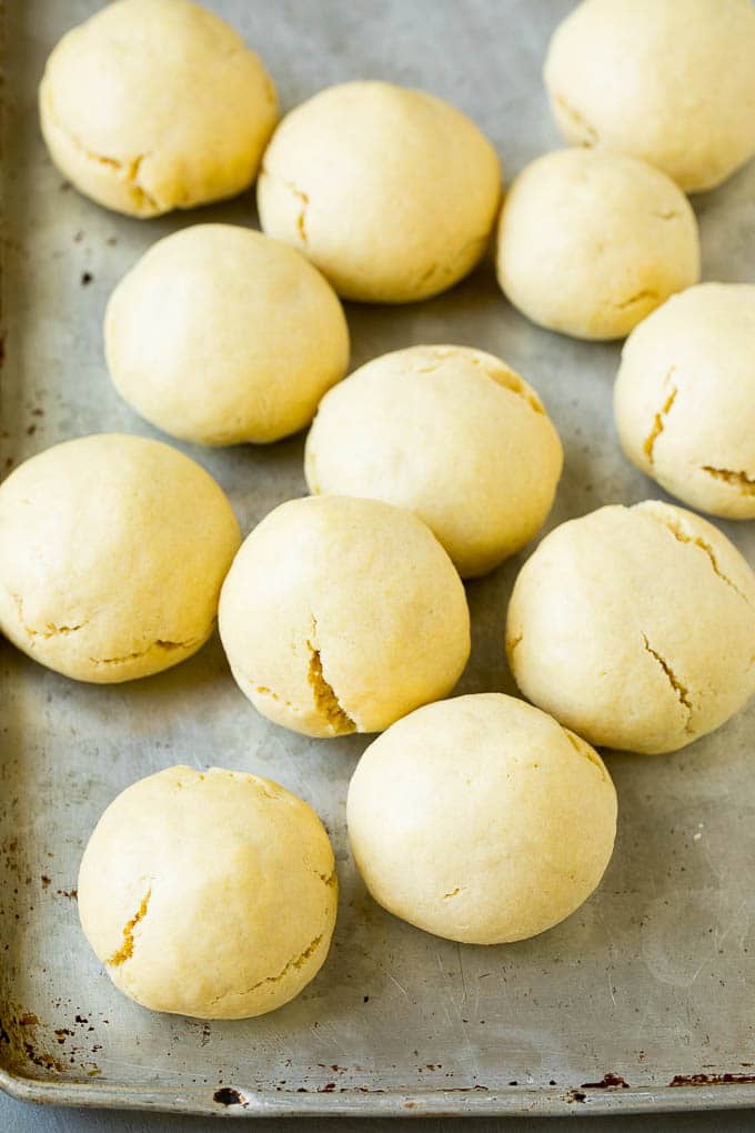 Italian Cookies Recipe | Almond Cookies #cookies #italianfood #frosting #sprinkles #baking #christmas #bajap Baked almond cookies on a baking sheet.