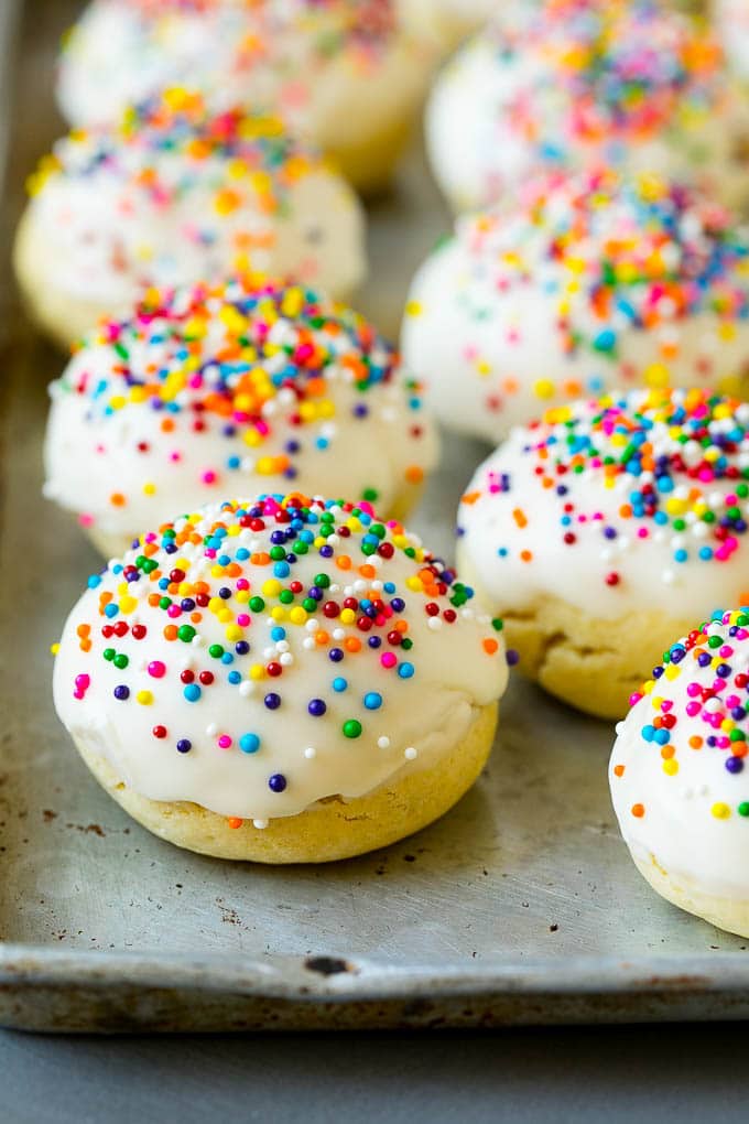 Italian Cookies Recipe | Almond Cookies #cookies #italianfood #frosting #sprinkles #baking #christmas #bajap Italian cookies covered in frosting and rainbow sprinkles.