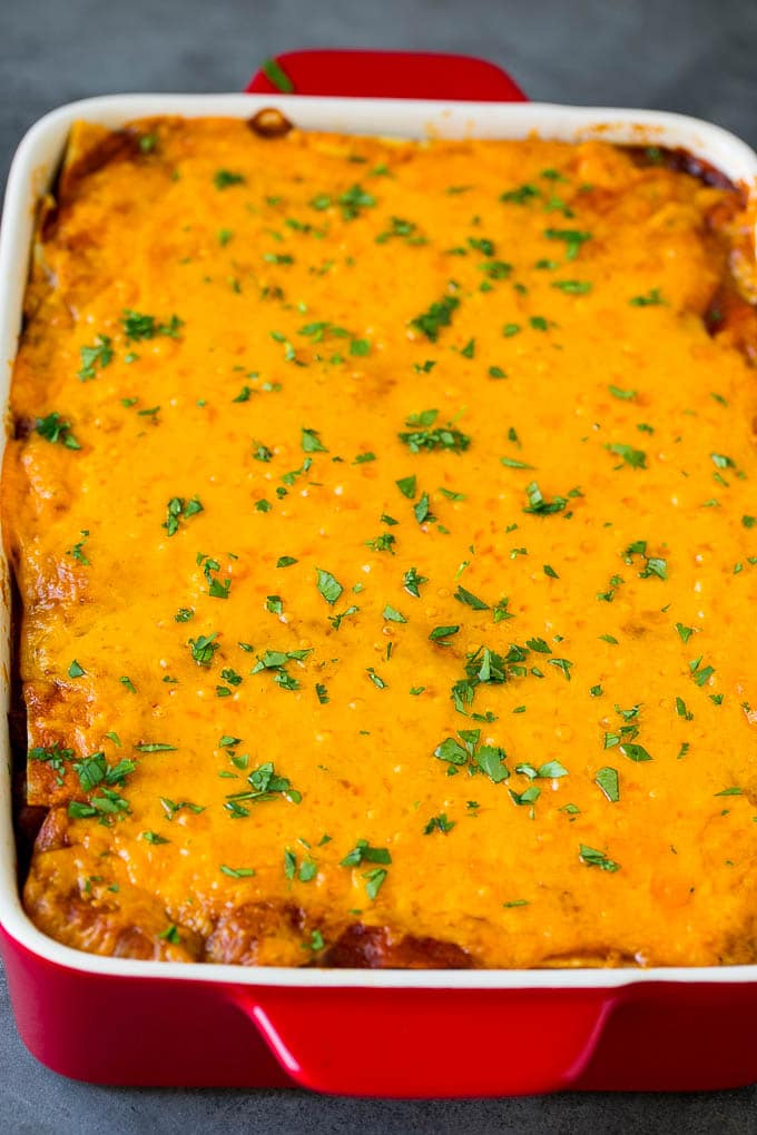 Mexican Lasagna Recipe | Mexican Casserole #mexican #lasagna #groundbeef #beans #dinner #cheese #bajap A baked Mexican casserole topped with melted cheese and cilantro.