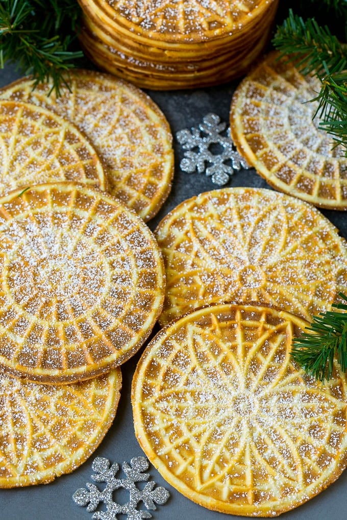 Pizzelle Cookies Recipe #cookies #baking #dessert #christmas #bajap Pizzelle cookies cooked to golden brown and coated in powdered sugar.