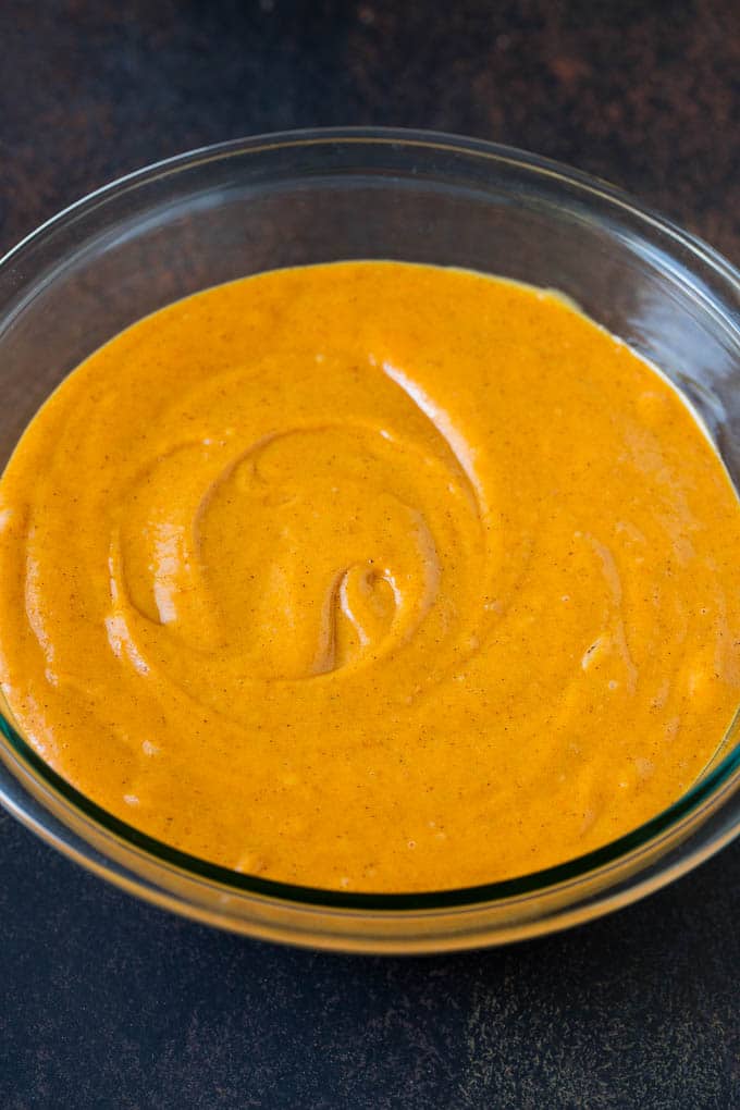Pumpkin Cake Recipe | Pumpkin Spice Cake #cake #pumpkin #dessert #baking #fall #thanksgiving #bajap Cake batter in a mixing bowl.