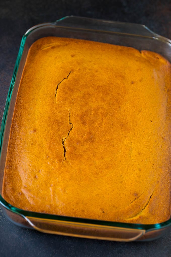 Pumpkin Cake Recipe | Pumpkin Spice Cake #cake #pumpkin #dessert #baking #fall #thanksgiving #bajap A baked base in a glass dish ready for frosting.