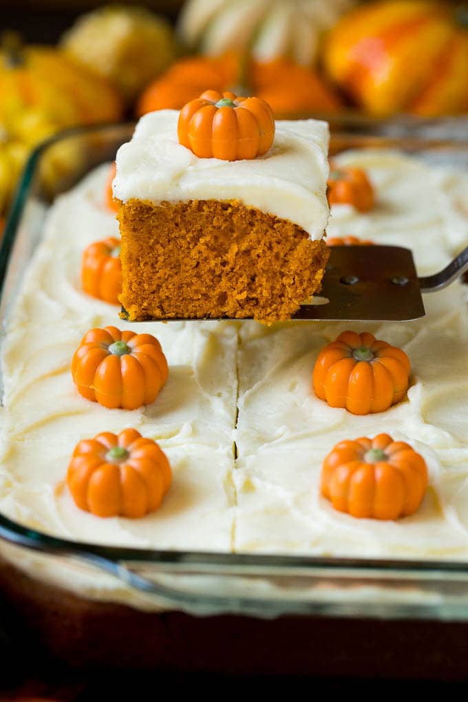 Pumpkin Cake Recipe | Pumpkin Spice Cake #cake #pumpkin #dessert #baking #fall #thanksgiving #bajap A spatula serving up a slice of pumpkin cake.