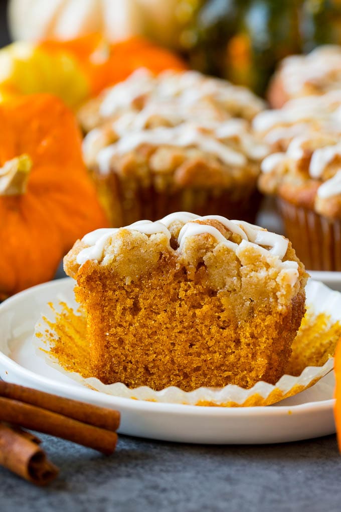 These pumpkin muffins are light and tender treats filled with plenty of pumpkin puree and spice, then topped with brown sugar streusel and baked to perfection. Pumpkin muffins topped with brown sugar streusel and vanilla glaze.