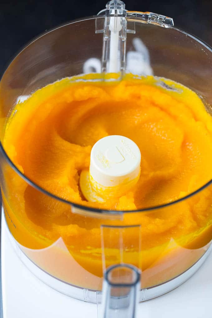 Pumpkin Puree Recipe #pumpkin #baking #fall #thanksgiving #bajap Pureed pumpkin in a food processor.