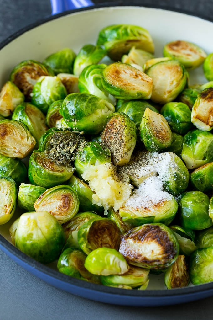 Sauteed Brussels Sprouts Recipe | Brussels Sprouts Side Dish #brusselssprouts #sprouts #veggies #sidedish #garlic #vegetarian #dinner #bajap Sprouts in a pan seasoned with salt, pepper, garlic and dried herbs.