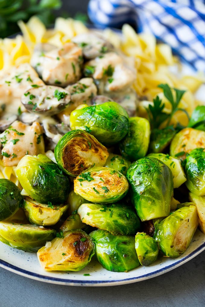 Sauteed Brussels Sprouts Recipe | Brussels Sprouts Side Dish #brusselssprouts #sprouts #veggies #sidedish #garlic #vegetarian #dinner #bajap Sauteed brussels sprouts served alongside chicken and noodles.