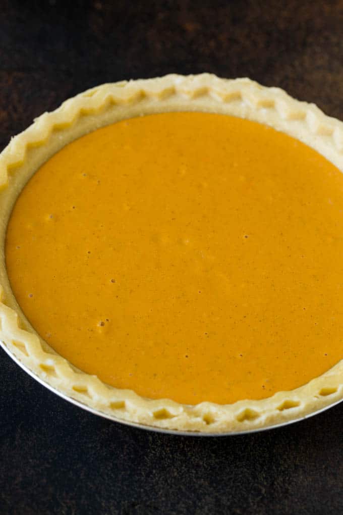 Homemade Pumpkin Pie Recipe | Pumpkin Pie #pie #pumpkin #baking #thanksgiving #fall #dessert #bajap Pie filling inside a pie crust.