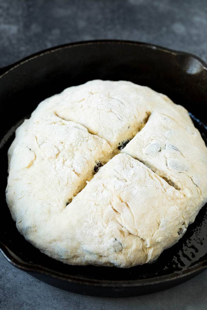 Irish Soda Bread Recipe #bread #baking #stpatricksday #sidedish #bajap A shaped loaf of soda bread in a skillet.