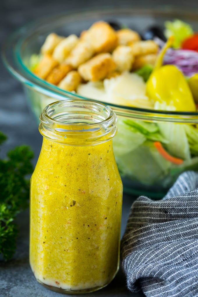 Olive Garden Salad Recipe | Italian Salad #salad #lettuce #olives #sidedish #dinner #bajap A bottle of homemade salad dressing.