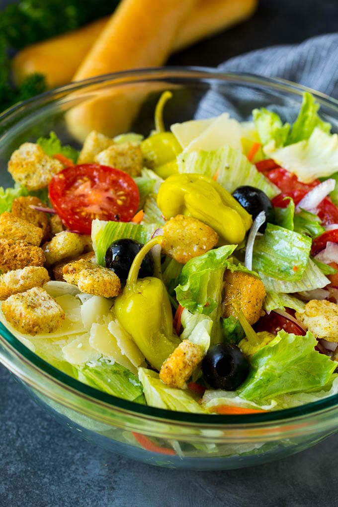Olive Garden Salad Recipe | Italian Salad #salad #lettuce #olives #sidedish #dinner #bajap A tossed Olive Garden salad with Italian dressing, vegetables and olives.