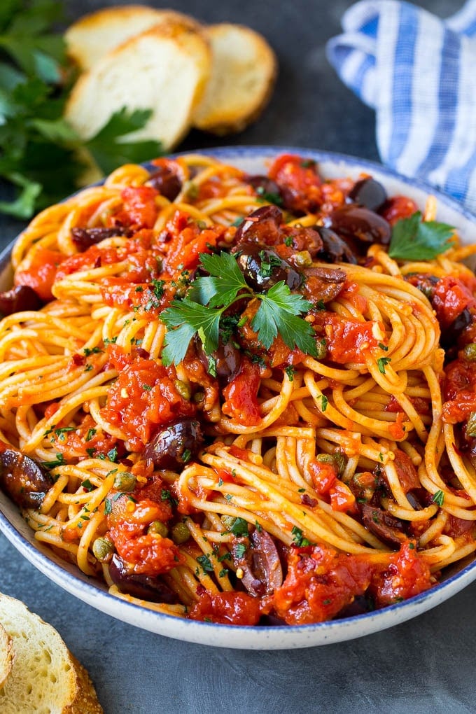 Pasta Puttanesca Recipe #pasta #tomatoes #olives #italianfood #dinner #bajap Pasta puttanesca with spaghetti tossed in a homemade tomato sauce.