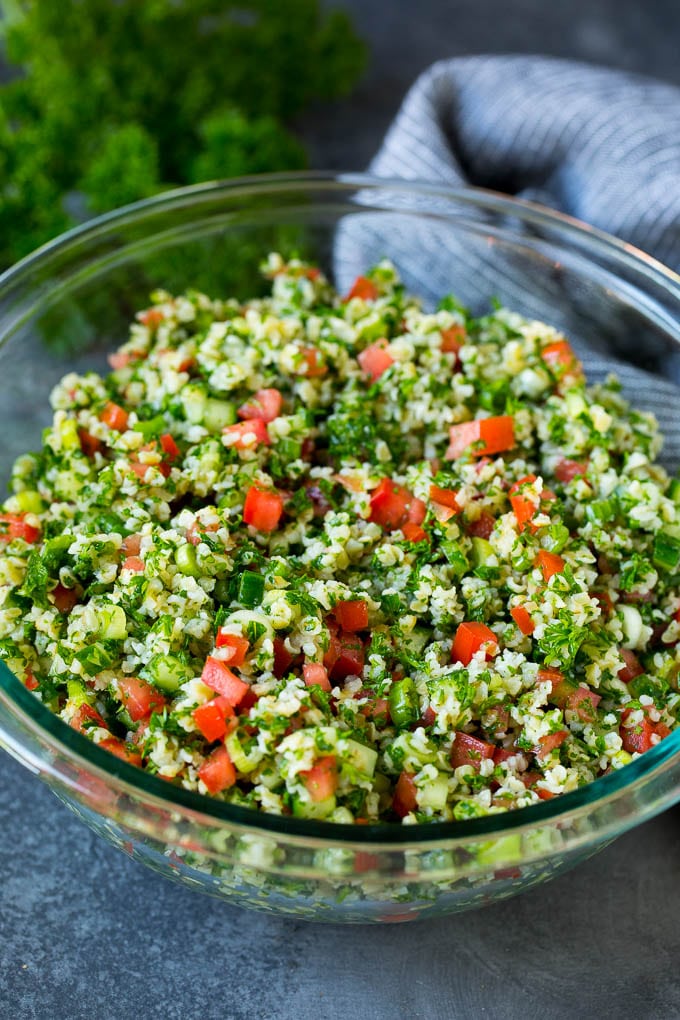 Tabbouleh Salad | Tabouli #salad #wheat #tomatoes #cucumber #healthy #sidedish #dinner #bajap A serving bowl filled with tabbouleh salad.