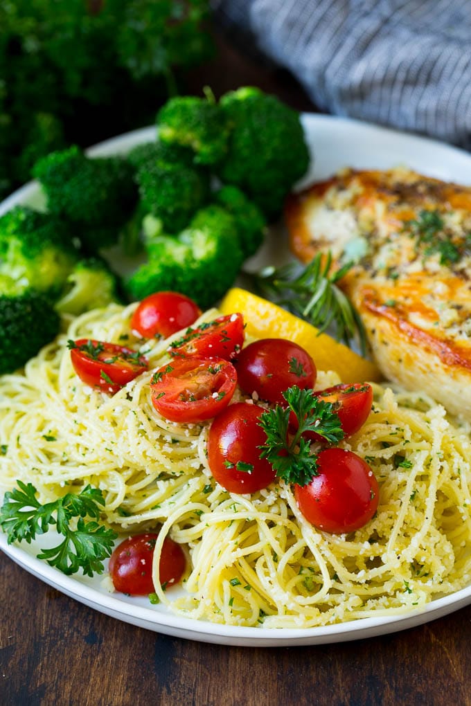 Garlic and Herb Angel Hair Pasta #pasta #garlic #sidedish #dinner #bajap Angel hair pasta served with chicken and broccoli.
