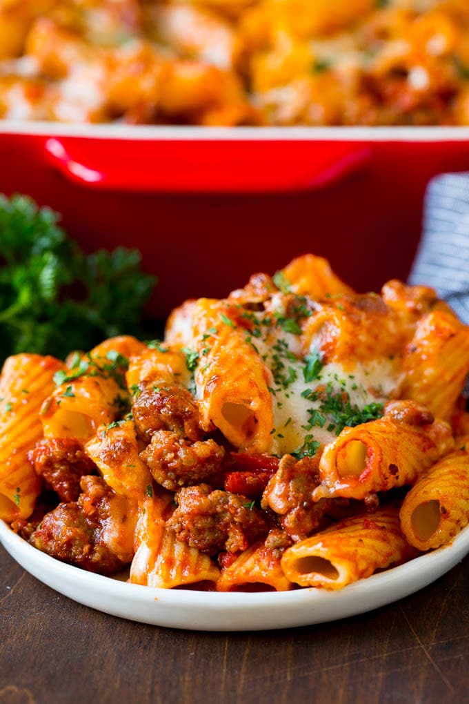Baked Rigatoni Pasta #pasta #dinner #italianfood #groundbeef #bajap #casserole A plate of baked rigatoni topped with melted cheese.