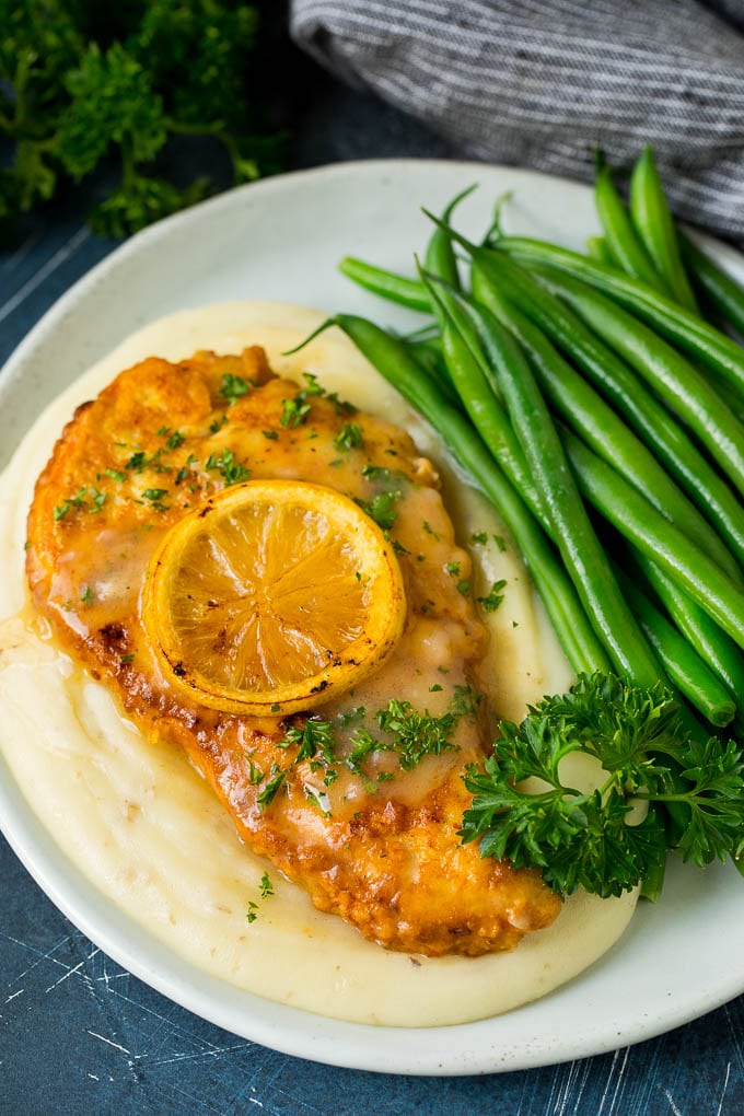 Chicken Francese Recipe #chicken #lemon #dinner #bajap Chicken francese served over mashed potatoes with green beans.