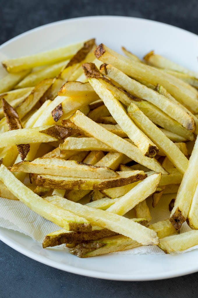 Homemade French Fries Recipe #potatoes #fries #dinner #bajap Par-fried potatoes on a plate.
