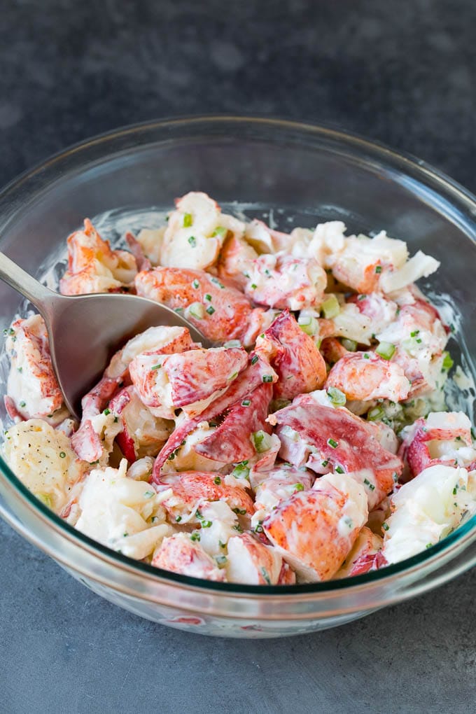 Lobster rolls stuffed with creamy lobster salad in a toasted bun. #lobster #bajap Lobster salad in a bowl in a creamy dressing.