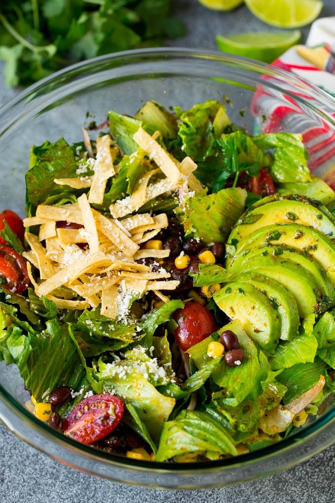 Mexican Salad Recipe #salad #corn #beans #avocado #tomatoes #bajap Mexican salad with lettuce, corn, beans and tomato, tossed in a lime dressing.
