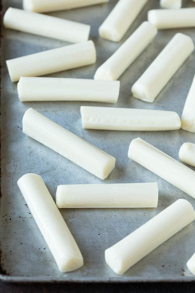 Mozzarella Sticks Recipe #cheese #appetizer #bajap Cheese sticks on a sheet pan.