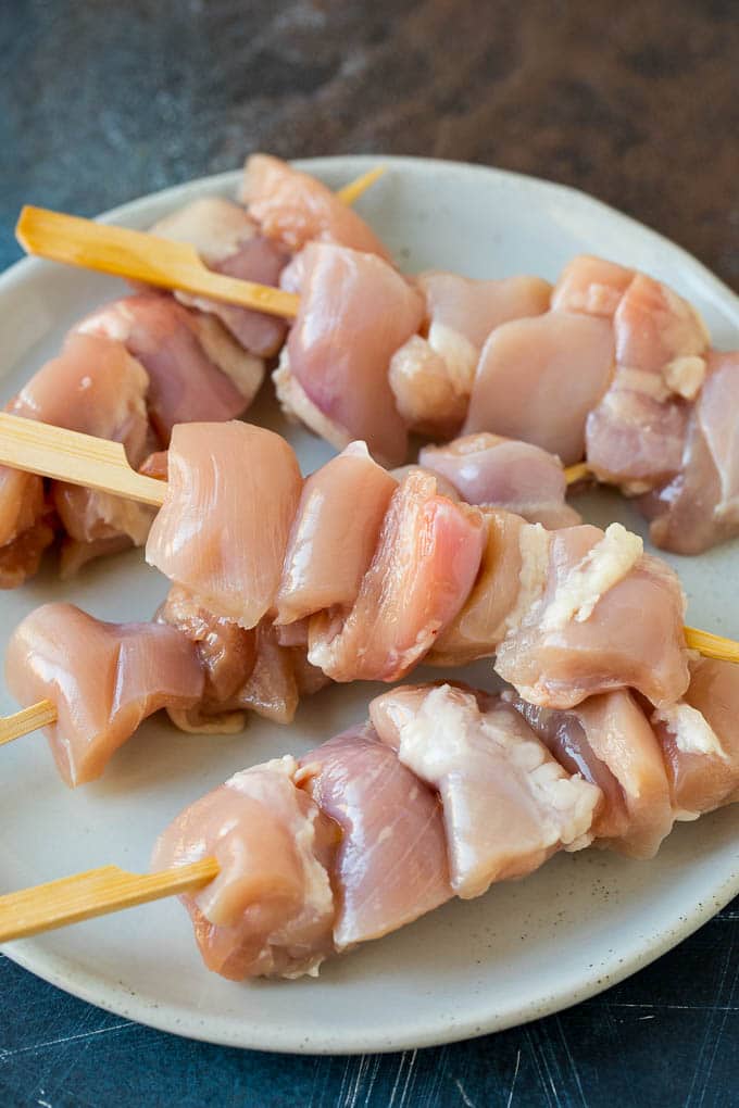 Chicken Yakitori Recipe | Grilled Chicken #chicken #grilling #dinner #bajap Raw chicken threaded onto skewers.