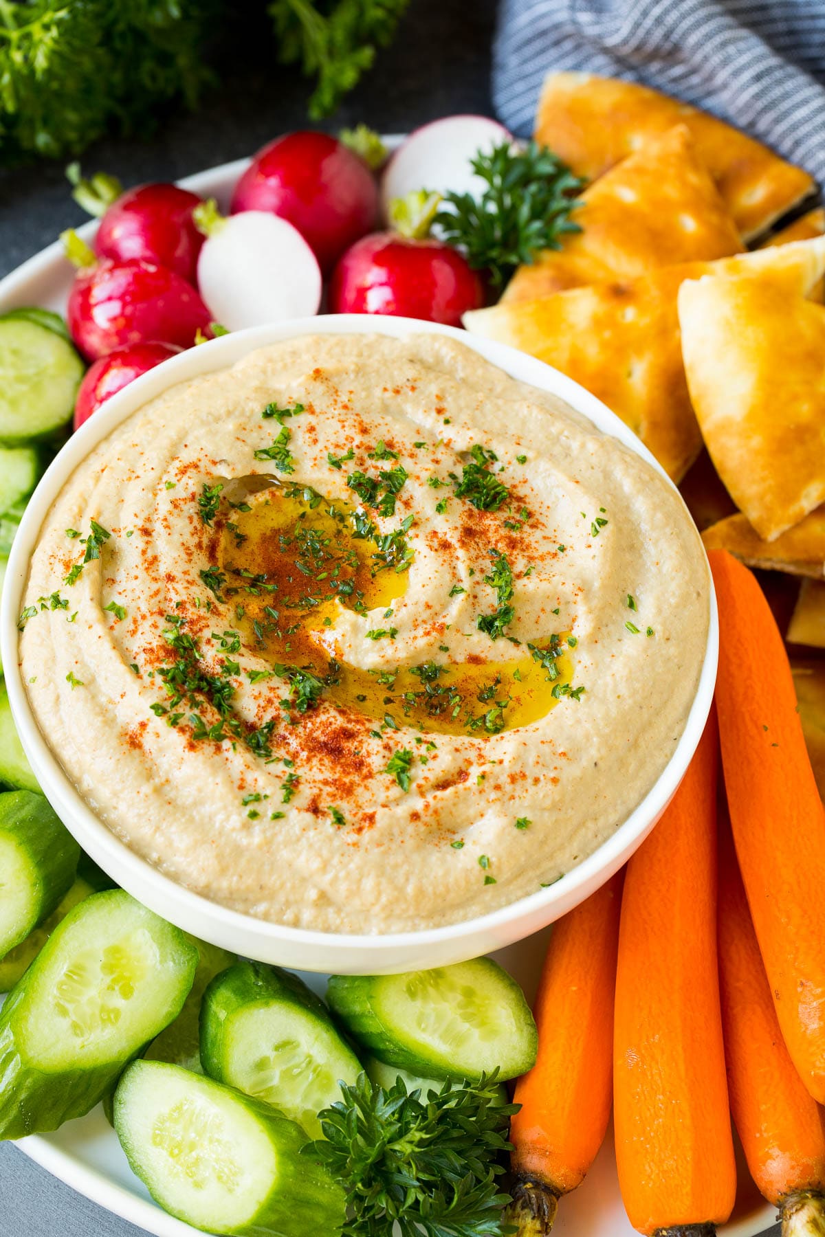 Baba Ganoush Recipe | Eggplant Dip #eggplant #appetizer #dip #healthy #glutenfree #lowcarb #bajap Baba ganoush in a bowl surrounded by bread and vegetables.