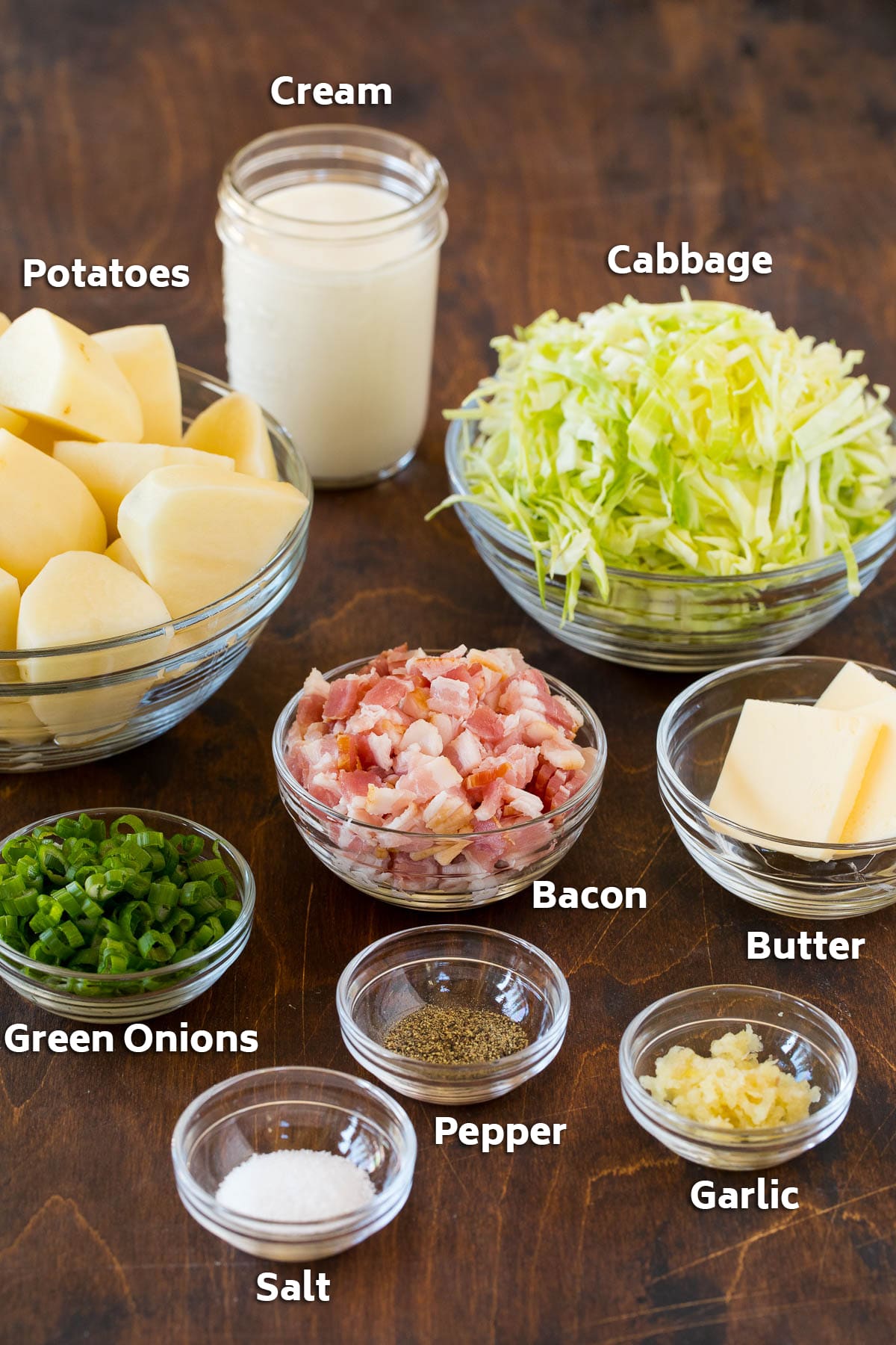 Colcannon Recipe | Mashed Potatoes #potatoes #cabbage #bacon #sidedish #stpatricksday #dinner #bajap Bowls of bacon, cabbage, potatoes, and seasonings.